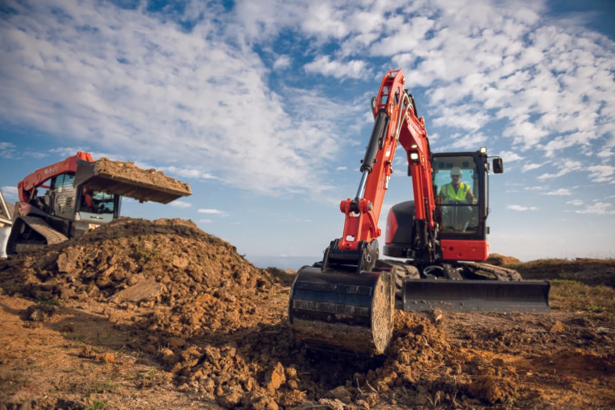 Kubota excavator and track loader on site